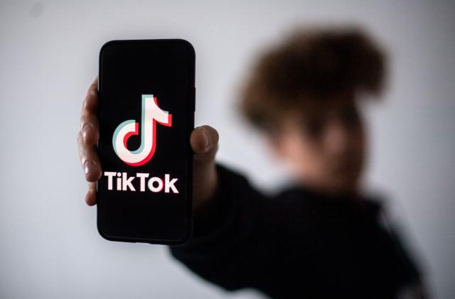 A teenager presents a smartphone with the logo of Chinese social network Tik Tok, on January 21, 2021 in Nantes, western France. (Photo by LOIC VENANCE / AFP) (Photo by LOIC VENANCE/AFP via Getty Images)