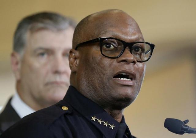 Dallas police chief David Brown, front, and Dallas mayor Mike Rawlings, rear, talk with the media during a news conference, Friday, July 8, 2016, in Dallas. (Photo: Eric Gay/AP)