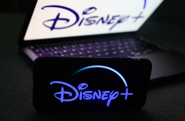 Disney+ logo displayed on a phone screen and Disney+ logo displayed on a laptop screen are seen in this illustration photo taken in Krakow, Poland on November 27, 2022. (Photo by Jakub Porzycki/NurPhoto via Getty Images)