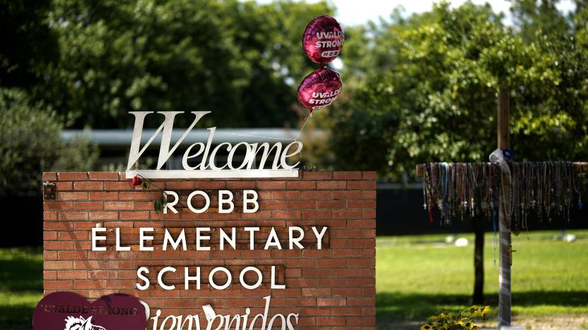 This photo taken on May 24, 2023 shows flowers and toys placed to mourn for victims of a school mass shooting at the former Robb Elementary School in Uvalde, Texas, the United States. The one-year anniversary of the school shooting killing 19 pupils and two teachers in Uvalde in the U.S. state of Texas arrives on Wednesday, marked by deep frustration as gun violence appears more rampant across the country. (Photo by Wu Xiaoling/Xinhua via Getty Images)