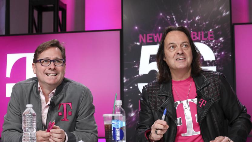IMAGE DISTRIBUTED FOR T-MOBILE -  Un-carrier President Mike Sievert and CEO John Legere answer caller questions during the announcement of the future New T-Mobile's Un-carrier Moves on Thursday, Nov. 7, 2019, in New York. The Un-carrier unveiled three new initiatives for the proposed combination of T-Mobile and Sprint including the Connecting Heroes Initiative, a 10-year commitment to providing free unlimited talk, text and smartphone data for public and non-profit U.S. state and local law enforcement, fire and EMS agencies. (Brian Ach/AP Images for T-Mobile)