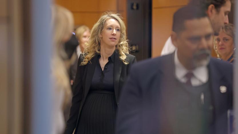 SAN JOSE, CALIFORNIA - NOVEMBER 18: Former Theranos CEO Elizabeth Holmes goes through a security checkpoint as she arrives at federal court on November 18, 2022 in San Jose, California. Holmes appeared in federal court for sentencing after being convicted of four counts of fraud for allegedly engaging in a multimillion-dollar scheme to defraud investors in her company Theranos, which offered blood testing lab services. (Photo by Justin Sullivan/Getty Images)