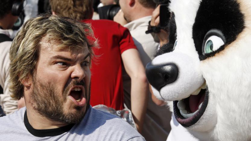 Voice actor Jack Black shouts near life-sized pandas during a beach photo call for the animated film "Kung Fu Panda" as the 61st Cannes Film Festival starts, May 14, 2008.  REUTERS/Jean-Paul Pelissier  (FRANCE)