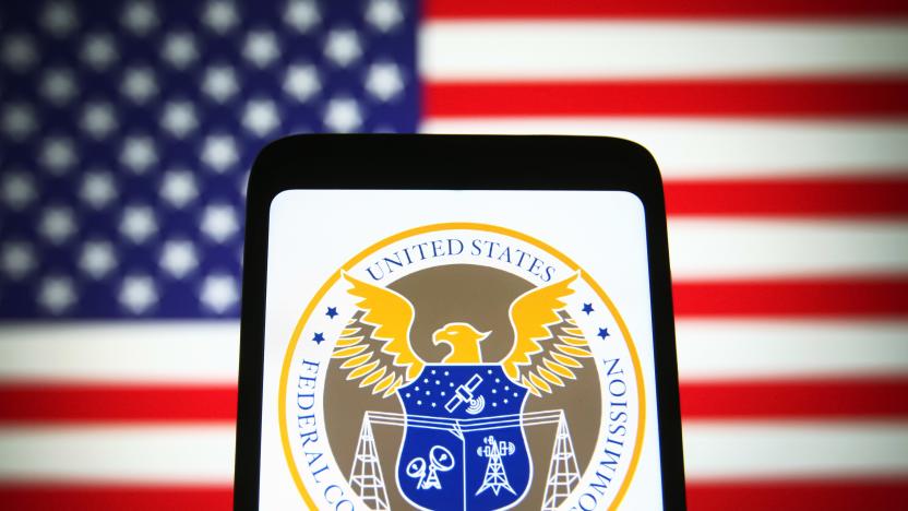 UKRAINE - 2021/11/25: In this photo illustration, U.S. Federal Communications Commission (FCC) seal is seen on a smartphone screen with the US flag in the background. (Photo Illustration by Pavlo Gonchar/SOPA Images/LightRocket via Getty Images)