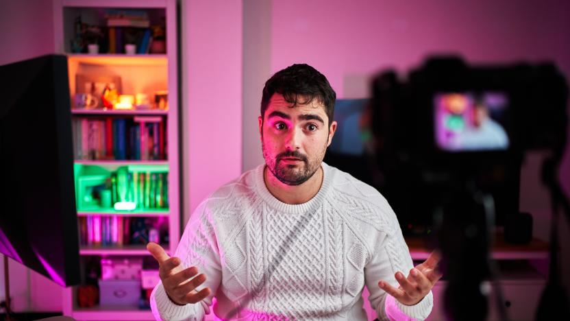 Young fat streamer on a room with multicolor lights