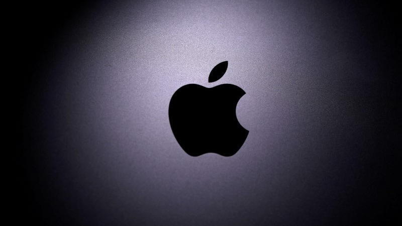 FILE PHOTO: Apple logo is seen on the MacBook in this illustration taken taken April 12, 2020. REUTERS/Dado Ruvic/Illustration/File Photo