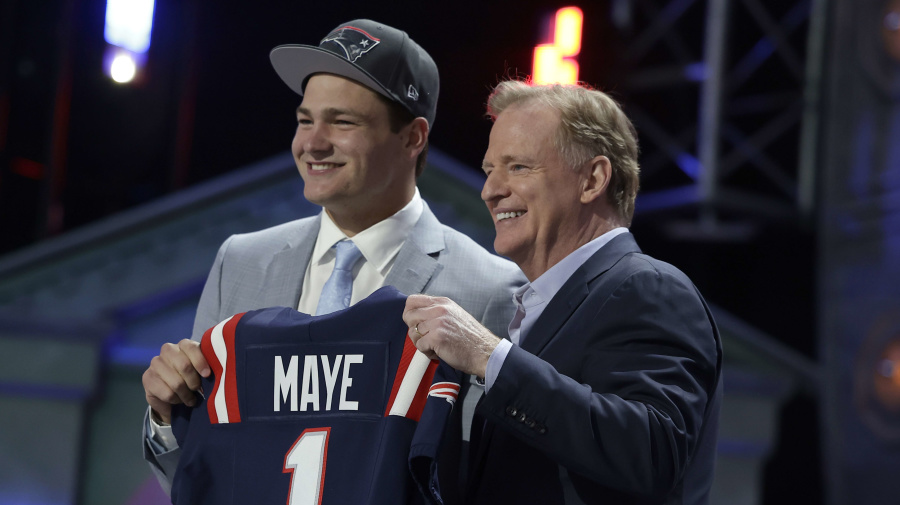 Associated Press - North Carolina quarterback Drake Maye poses after being chosen by the New England Patriots with the third overall pick during the first round of the NFL football draft on Thursday, April 25, 2024 in Detroit. (Adam Hunger/AP Images for the NFL)