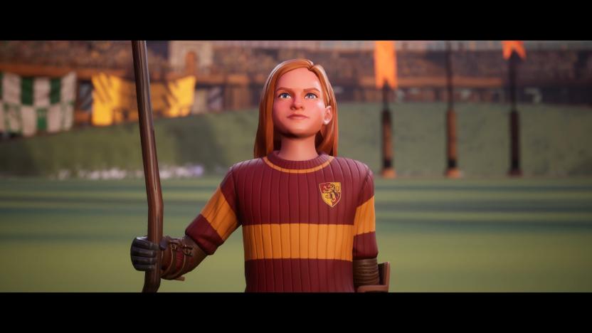 Still from the trailer for the game Harry Potter: Quidditch Champions, featuring Hermione Granger standing proud on the field while holding a broomstick.