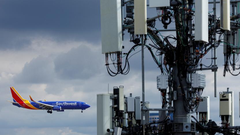 A Southwest commercial aircraft flies near a cell phone tower as it approaches to land at John Wayne Airport in Santa Ana, California U.S. January 18, 2022. U.S. airlines said on Wednesday the rollout of new 5G services was having only a minor impact on air travel as the U.S. Federal Aviation Administration (FAA) said it has issued new approvals to allow more low-visibility landings.    REUTERS/Mike Blake