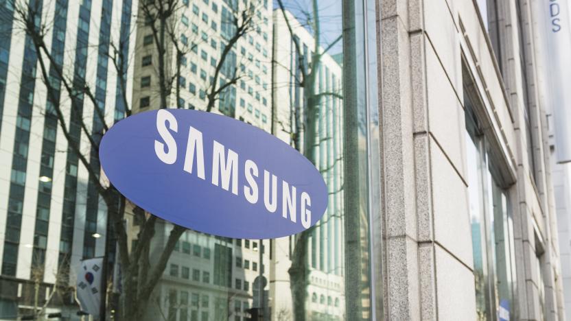 Seoul, Republic of Korea - March 26, 2013: The Samsung logo on the window of one of the South Korean company's offices in Gangnam, central Seoul, with cars and people on the street reflected  in the window.