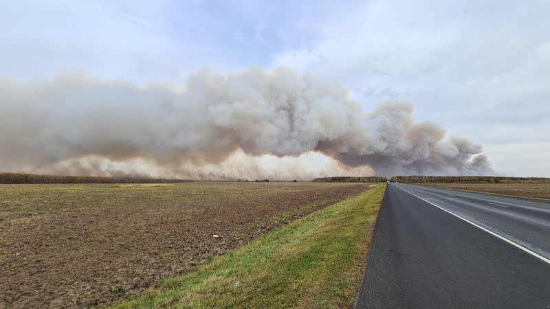 Smoke rises from the site of a fire at an ammunition depot in Ryazan Region