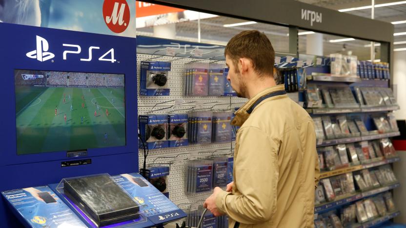 A customer plays a game on PlayStation 4 (PS4) in a store of Russia's biggest electrical and white goods retailer M.video in Moscow, Russia, April 15, 2016. REUTERS/Maxim Zmeyev