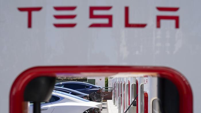 File - Tesla vehicles charge at a station in Emeryville, Calif., Wednesday, Aug. 10, 2022. Tesla reports earnings on Wednesday, Oct. 18, 2023 (AP Photo/Godofredo A. Vásquez, File)