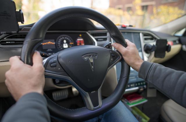 24 November 2019, Berlin: View of the steering wheel of a Tesla (Model S, year 2014). Photo: Jörg Carstensen/dpa (Photo by Jörg Carstensen/picture alliance via Getty Images)