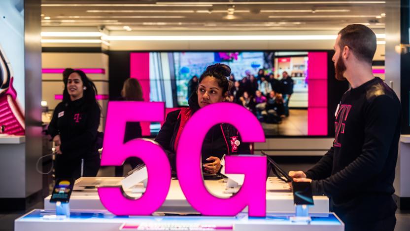 NEW YORK CITY, UNITED STATES - 2020/02/20: Customers at a T-Mobile store, with 5G signage. (Photo Illustration by Alex Tai/SOPA Images/LightRocket via Getty Images)