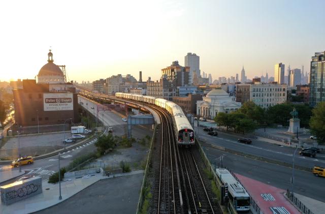 NEW YORK, USA - AUGUST 11: Subway trains run over the Williamsburg Bridge as the sun sets on August 11, 2020 in New York City, United States. (Photo by Lokman Vural Elibol/Anadolu Agency via Getty Images)