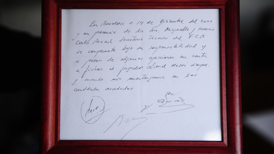 Associated Press - FILE - A framed copy of the napkin linking the 13-year-old Lionel Messi to FC Barcelona is seen in Barcelona, Spain on Jan. 5, 2012. British auction house Bonhams says the famous napkin that linked a young Lionel Messi to Barcelona has sold for $965,000. An agreement in principle to sign then 13-year-old Messi was written on the napkin almost 25 years ago at a Barcelona tennis club. (AP Photo/Manu Fernandez, File)