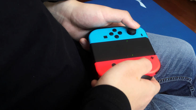 Chinese tutor Zhao plays a game on Nintendo Switch at his apartment in Beijing, China April 24, 2020. Picture taken April 24, 2020. REUTERS/Martin Pollard