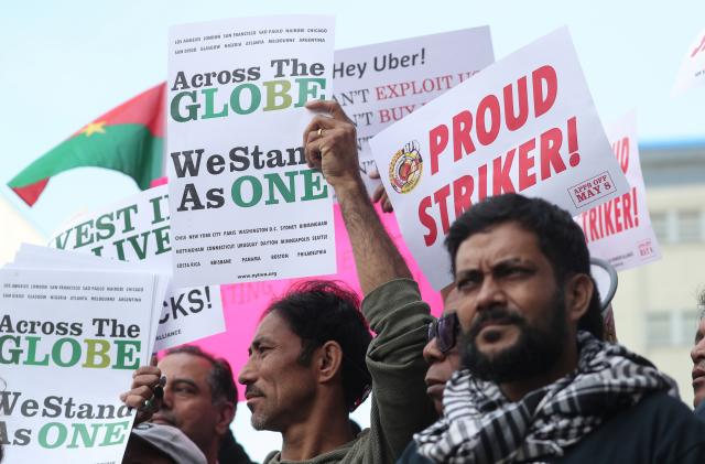 Drivers takes part in a protest against Uber and other app-based ride-hailing companies outside the Uber Greenlight offices in the Queens borough of New York, U.S., May 8, 2019. REUTERS/Shannon Stapleton.