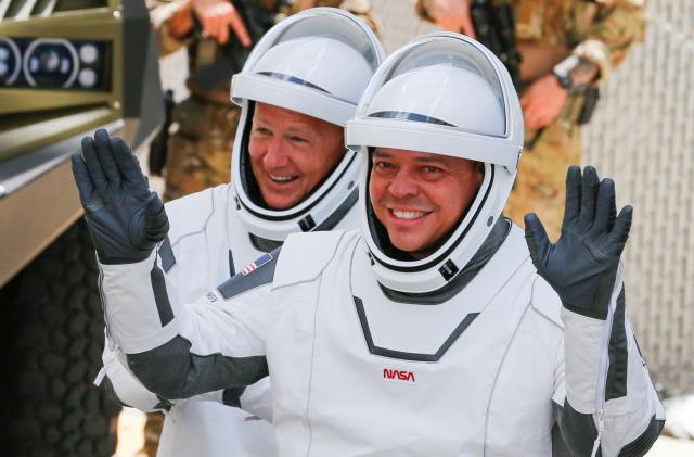 NASA astronauts Douglas Hurley and Robert Behnken head to launch pad 39 to board a SpaceX Falcon 9 rocket for a second launch attempt on NASA?s SpaceX Demo-2 mission to the International Space Station from NASA?s Kennedy Space Center in Cape Canaveral, Florida, U.S.  May 30, 2020. REUTERS/Joe Skipper