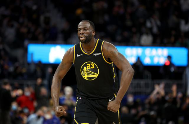 SAN FRANCISCO, CALIFORNIA - JANUARY 03:  Draymond Green #23 reacts after Jordan Poole #3 of the Golden State Warriors dunks the ball on Omer Yurtseven #77 of the Miami Heat in the second half at Chase Center on January 03, 2022 in San Francisco, California. NOTE TO USER: User expressly acknowledges and agrees that, by downloading and/or using this photograph, User is consenting to the terms and conditions of the Getty Images License Agreement.  (Photo by Ezra Shaw/Getty Images)