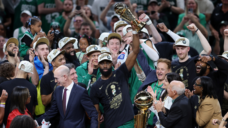 Getty Images - BOSTON, MASSACHUSETTS - JUNE 17: Jaylen Brown #7 of the Boston Celtics holds up the Bill Russell NBA Finals Most Valuable Player award after Boston's 106-88 win against the Dallas Mavericks in Game Five of the 2024 NBA Finals at TD Garden on June 17, 2024 in Boston, Massachusetts. NOTE TO USER: User expressly acknowledges and agrees that, by downloading and or using this photograph, User is consenting to the terms and conditions of the Getty Images License Agreement. (Photo by Adam Glanzman/Getty Images)