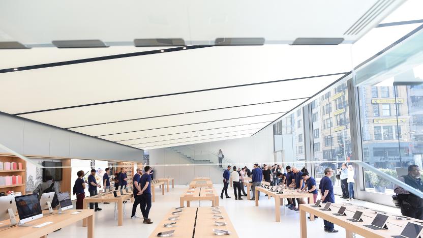 Workers staff a new Apple retail store during a media preview in San Francisco, California, U.S., May 19, 2016. REUTERS/Noah Berger