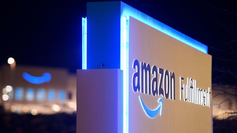 A sign at the Amazon.com, Inc. BHM1 fulfillment center is seen before sunrise on March 29, 2021 in Bessemer, Alabama. - Votes are set to be counted on March 29, 2021 on whether to create the first Amazon union in the United States, at a warehouse in Alabama, after a historic, five months-long David vs Goliath campaign. "I'm proud of the workers at Amazon for standing up and saying enough," said Joshua Brewer, the local president of the Retail, Wholesale and Department Store Union. (Photo by Patrick T. FALLON / AFP) (Photo by PATRICK T. FALLON/AFP via Getty Images)