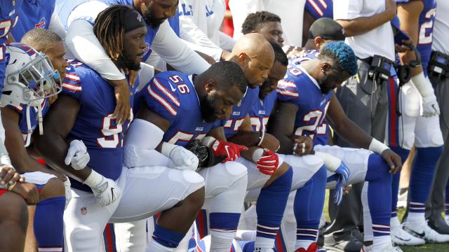 Why NFL players should keep standing up to Trump