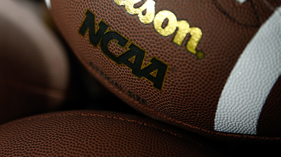 Getty Images - CHARLOTTE, NORTH CAROLINA - DECEMBER 2: The Wilson and NCAA Logo is shown on a football as the Louisville Cardinals take on the Florida State Seminoles during the ACC Championship at Bank of America Stadium on December 2, 2023 in Charlotte, North Carolina. (Photo by Isaiah Vazquez/Getty Images)