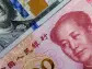 Chinese stocks, yuan react to Moody's credit outlook cut