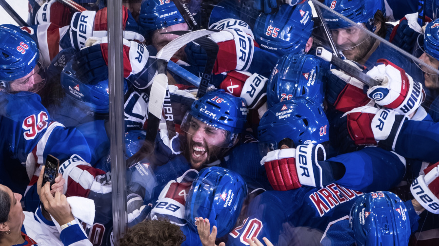 Getty Images - NEW YORK, NEW YORK - MAY 07: (EDITOR'S NOTE: Alternate crop) Vincent Trocheck #16 of the New York Rangers celebrates his game-winning goal with teammates in the second overtime against the Carolina Hurricanes in Game Two of the Second Round of the 2024 Stanley Cup Playoffs at Madison Square Garden on May 07, 2024 in New York City. The Rangers defeated the Hurricanes 4-3 in double-overtime. (Photo by Michael Mooney/NHLI via Getty Images)