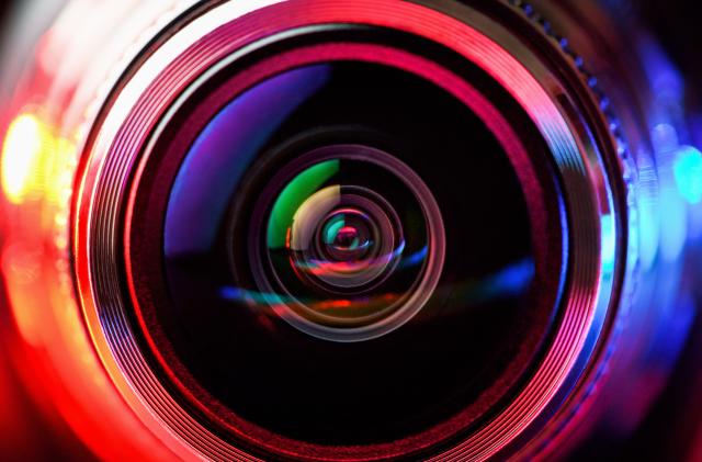 Camera lens with red and blue backlight. Macro photography lenses. Horizontal photography