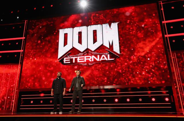 LOS ANGELES, CALIFORNIA - JUNE 09:   (L-R) Hugo Martin, Art Director at Id Software, and Marty Stratton, Executive Producer and Game Director at Id Software, preview 'Doom Eternal' during the Bethesda E3 Showcase at The Shrine Auditorium on June 09, 2019 in Los Angeles, California. (Photo by Christian Petersen/Getty Images)