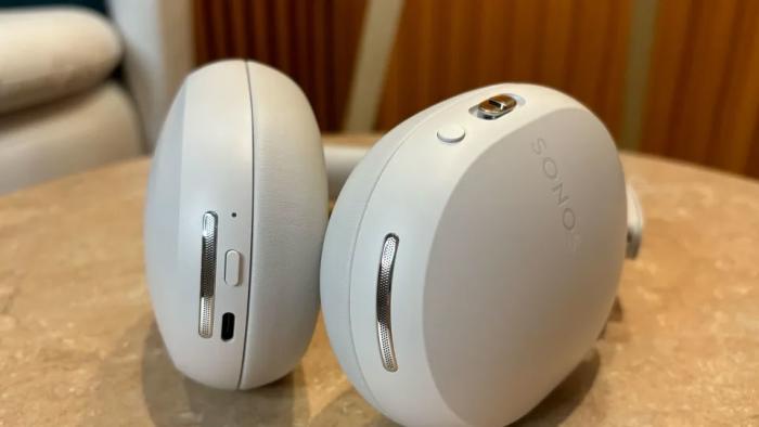 Image of a cream pair of Sonos Ace on a table