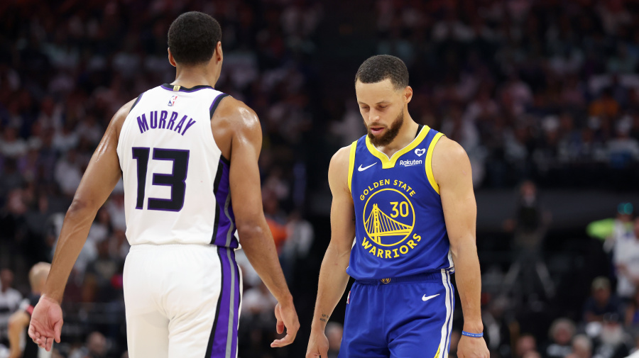 Getty Images - SACRAMENTO, CALIFORNIA - APRIL 16: Stephen Curry #30 of the Golden State Warriors walks back downcourt with his head down next to Keegan Murray #13 of the Sacramento Kings in the first quarter during the Play-In Tournament at Golden 1 Center on April 16, 2024 in Sacramento, California.  NOTE TO USER: User expressly acknowledges and agrees that, by downloading and or using this photograph, User is consenting to the terms and conditions of the Getty Images License Agreement.  (Photo by Ezra Shaw/Getty Images)