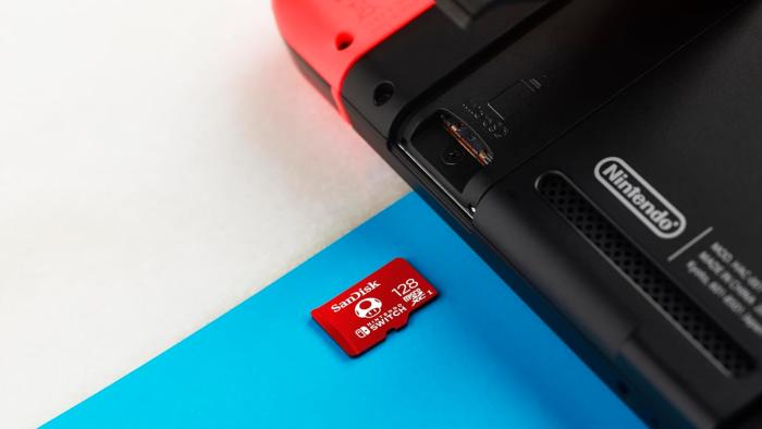 A microSD card sliding into the Switch.