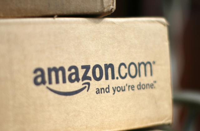 A box from Amazon.com is pictured on the porch of a house in Golden, Colorado July 23, 2008. Online retailer Amazon.com Inc said on Wednesday its quarterly profit doubled on a 41 percent rise in revenue, sending its shares up more than 6 percent.  REUTERS/Rick Wilking (UNITED STATES)