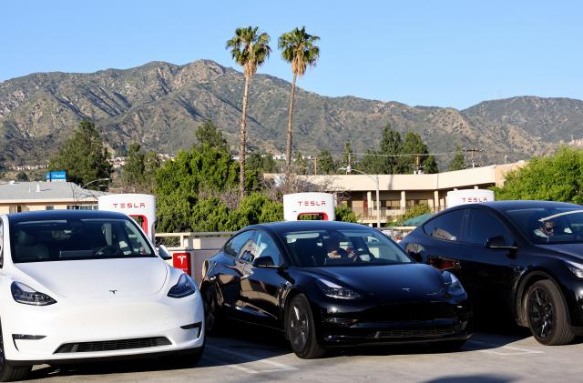 BURBANK, CALIFORNIA - APRIL 14: Tesla cars recharge at a Tesla Supercharger station on April 14, 2022 in Burbank, California. California has unveiled a proposal which would end the sale of gasoline-powered cars while requiring all new cars to have zero emissions by 2035. (Photo by Mario Tama/Getty Images)