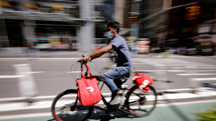 A rider for "Grubhub" food delivery service rides a bicycle during a delivery in midtown Manhattan following the outbreak of the coronavirus disease (COVID-19) in New York City, New York, U.S., July 9, 2020. REUTERS/Mike Segar