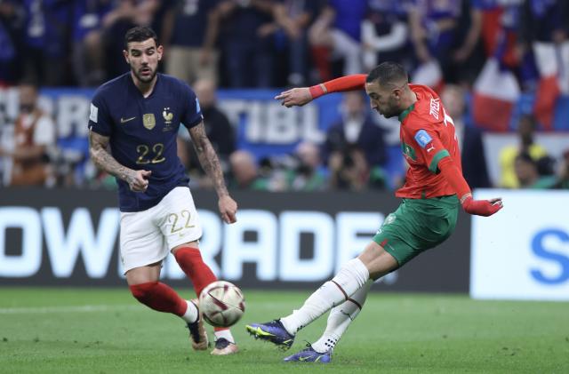 AL KHOR, QATAR - DECEMBER 14: Theo Hernandez (22) of France in action against Hakim Ziyech (R) of Morocco during the FIFA World Cup Qatar 2022 semi-final match between France and Morocco at Al Bayt Stadium on December 14, 2022 in Al Khor, Qatar. (Photo by Fareed Kotb/Anadolu Agency via Getty Images)