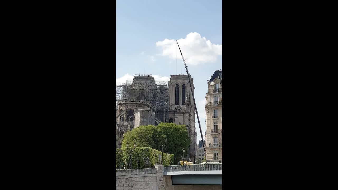 New golden rooster weathervane installed atop Notre Dame Cathedral spire -  CBS News