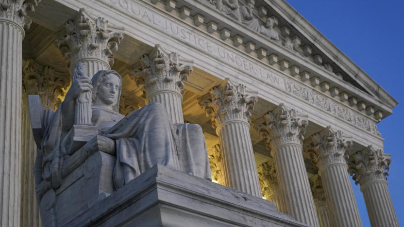 FILE- Light illuminates part of the Supreme Court building on Capitol Hill in Washington, Nov. 16, 2022. The Supreme Court has agreed to hear a Biden administration appeal to limit lawsuits filed by members of Congress against the federal government, in a case that stems from disputes over the Trump International Hotel in Washington. (AP Photo/Patrick Semansky, File)