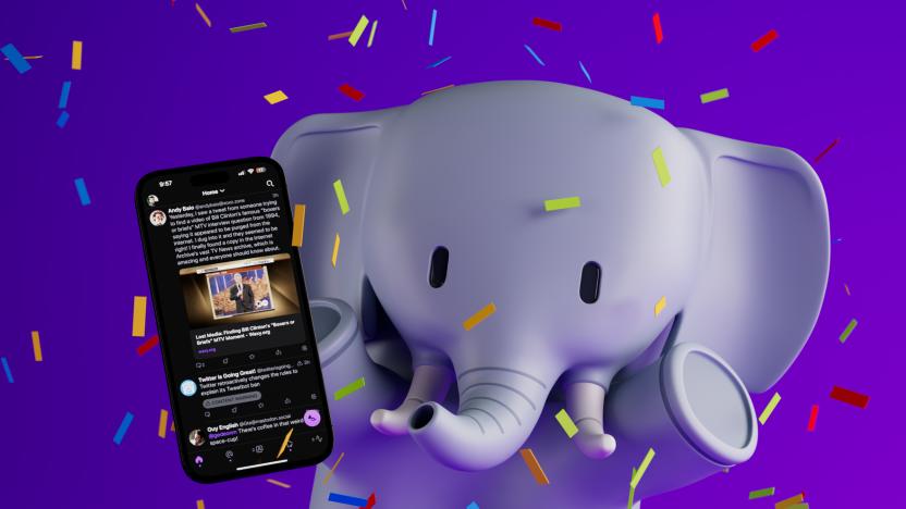 An elephant holding an iPhone with new Mastodon client Ivory running on-screen and colorful confetti raining down.