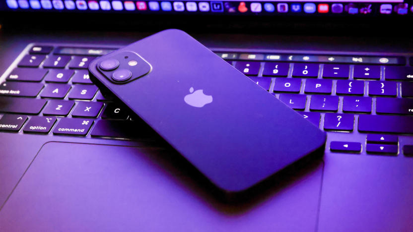 TOKYO, JAPAN - 2021/06/06: In this photo illustration, Apples iPhone 12 seen placed on a MacBook Pro. (Photo Illustration by Stanislav Kogiku/SOPA Images/LightRocket via Getty Images)