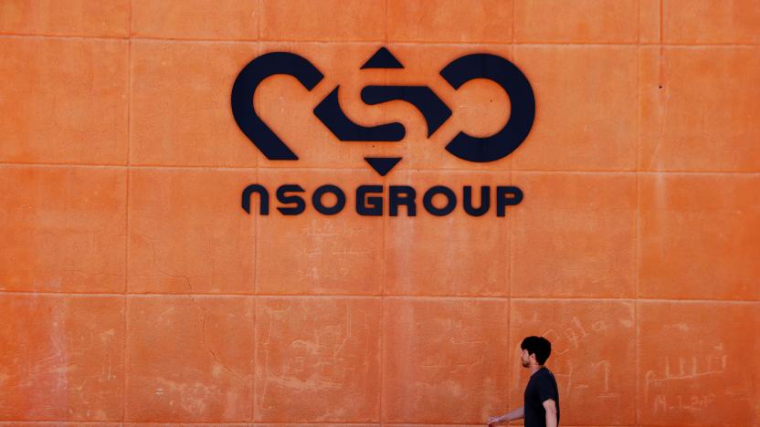 A man walks past the logo of Israeli cyber firm NSO Group at one of its branches in the Arava Desert, southern Israel July 22, 2021. REUTERS/Amir Cohen