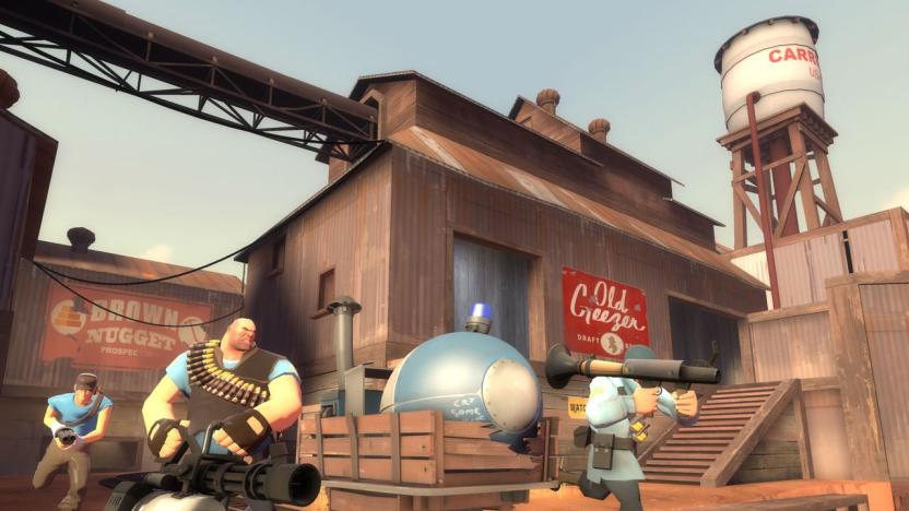 Team Fortress 2 screenshot showing a Blue scout, heavy and soldier moving a payload. 