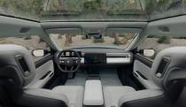 Front seats and dashboard of a Rivian vehicle.