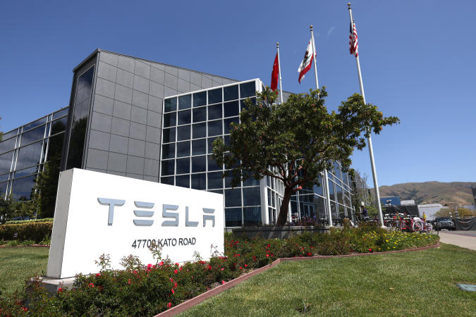 FREMONT, CALIFORNIA - APRIL 20: A sign is posted in front of a Tesla office on April 20, 2022 in Fremont, California. Tesla reported first quarter earnings that far exceeded analyst expectations with revenue of $18.76 billion compared to expectations of $17.80 billion. (Photo by Justin Sullivan/Getty Images)