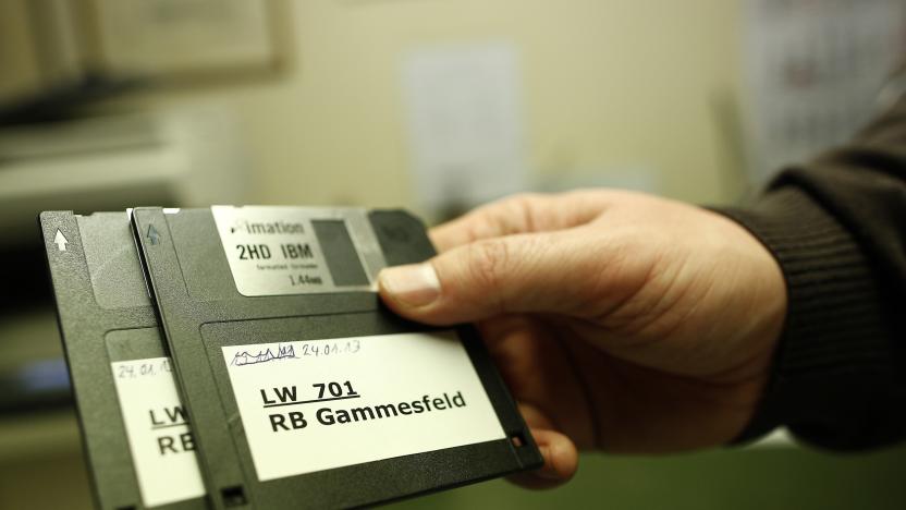 Peter Breiter, CEO of Raiffeisen Gammesfeld eG bank, displays the latest floppy disks at the bank in Gammesfeld, Baden-Wuerttemberg January 29, 2013. The Raiffeisen Gammesfeld eG cooperative bank is one of the country's smallest banks and is the only one to be run by just one member of staff. All banking duties are done by CEO Peter Breiter who records the daily business by hand, partly on paper. The bank is not connected to a database system, there are no automatic teller machines (ATMs) and its customer base consists only of residents of the town of Gammesfeld which has a population of around 510. Picture taken January 29, 2013. REUTERS/Lisi Niesner  (GERMANY - Tags: BUSINESS SOCIETY)

ATTENTION EDITORS: PICTURE 15 OF 26 FOR PACKAGE 'GERMANY'S ONE MAN BANK'. 
TO FIND ALL IMAGES SEARCH 'Raiffeisen'